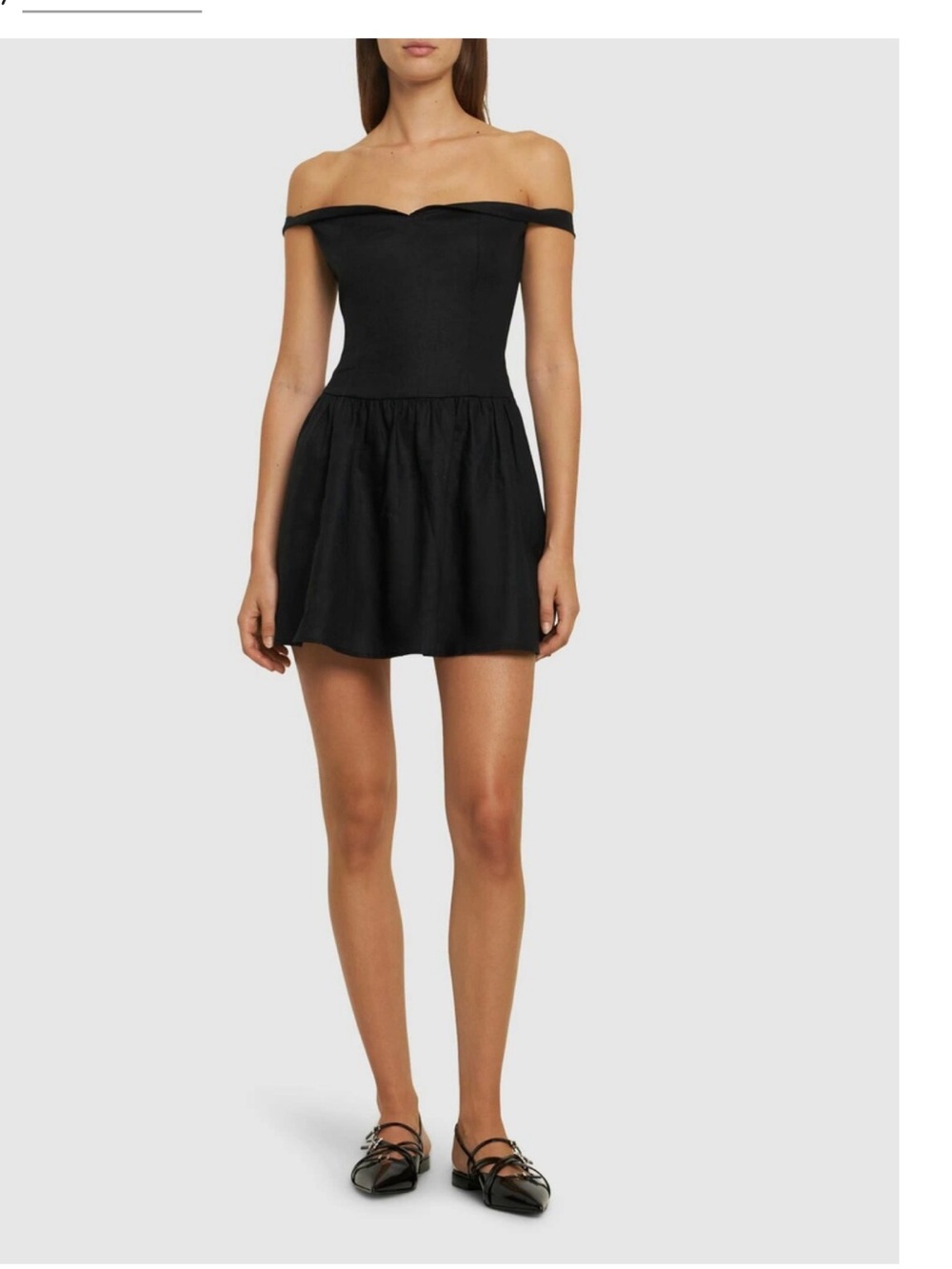 Reformation Off-the-shoulder neckline.
Back smocking at top panel.